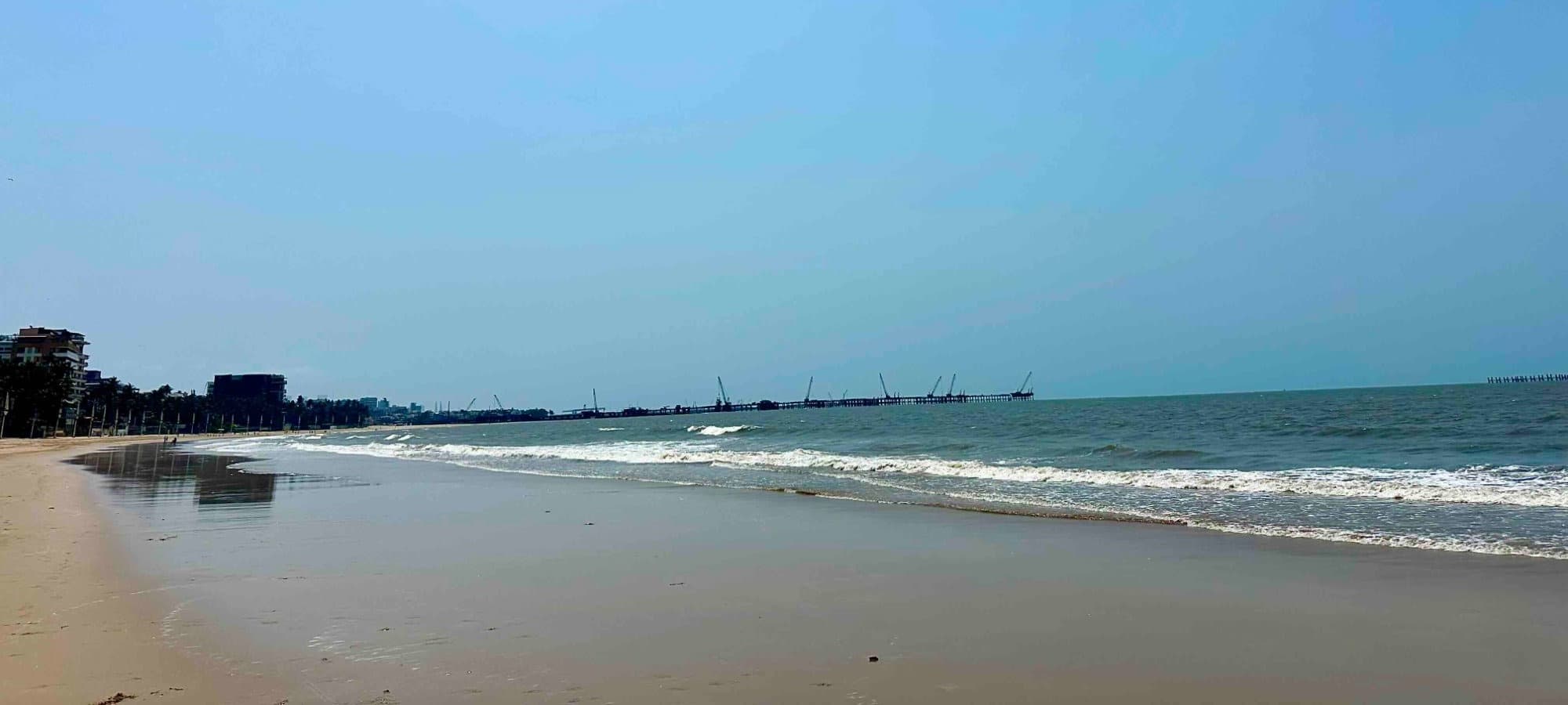 Juhu Beach on a quiet afternoon — empty sand, gentle waves, open sky