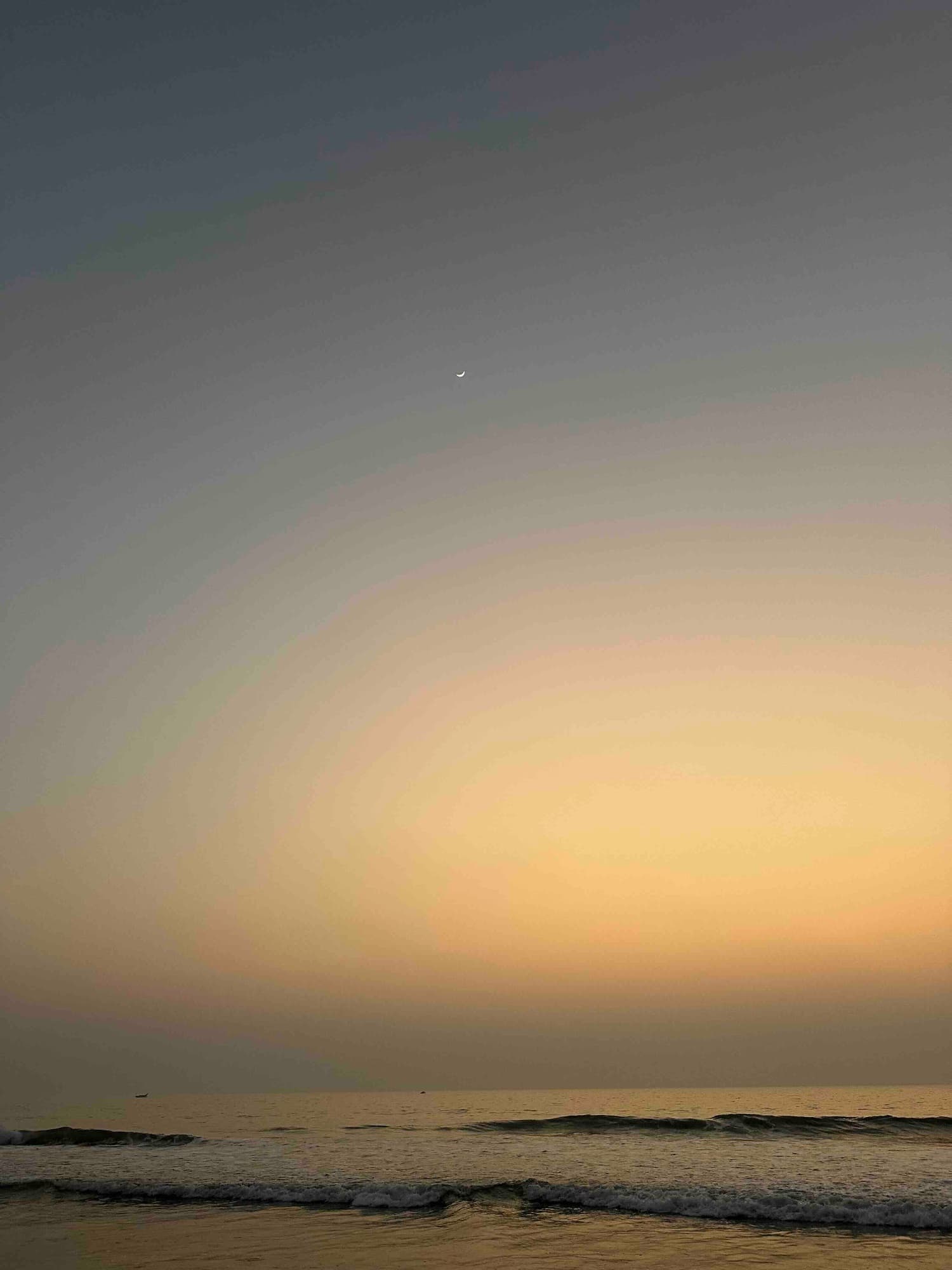 Twilight deepens, the crescent sharp against softening pastels