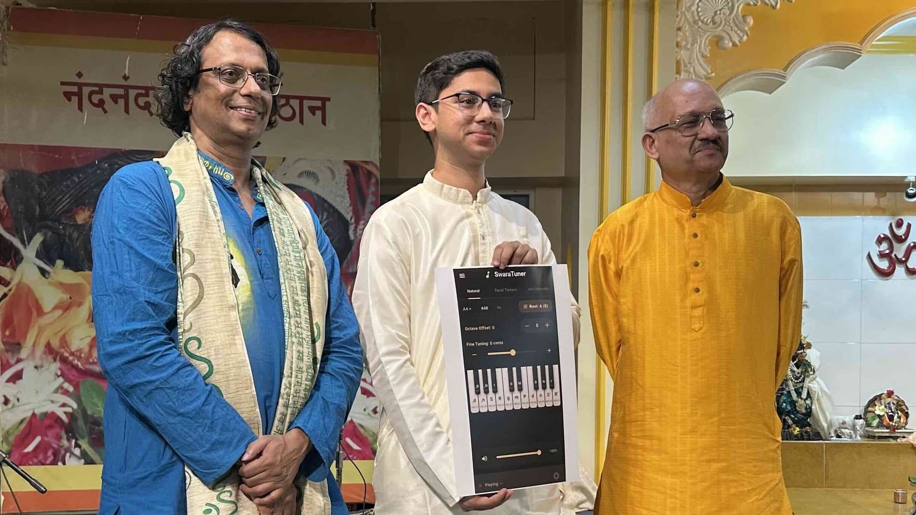 Pandit Milind Date, Ninad Barve and Colonel (Retired) Shrinivas Pande at the soft launch of SwaraTuner in Pune, with Ninad holding a printout of the app screen